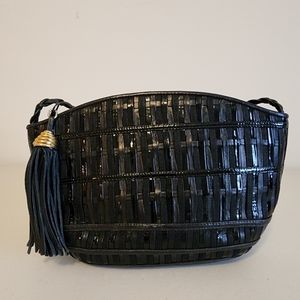 Black vintage style handbag. Tassel on zipper.